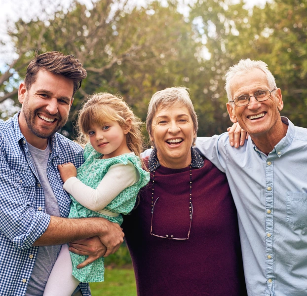 Family smiling together at Aesthetic Elements Dental Studio in Trumbull, CT