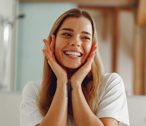 Smiling woman promoting healthy gums through professional gum care treatment