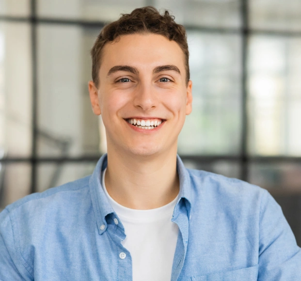 Smiling patient with a healthy smile after restorative dental treatment